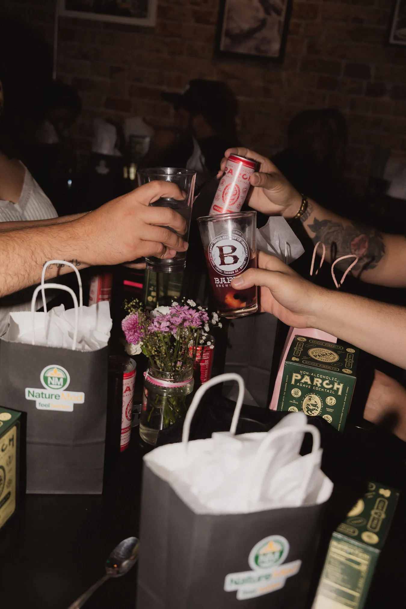 Members raising a toast together over drinks at a Doobie event.